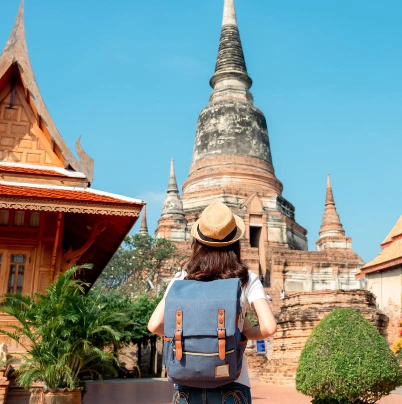 Woman looking at a temple in thailand